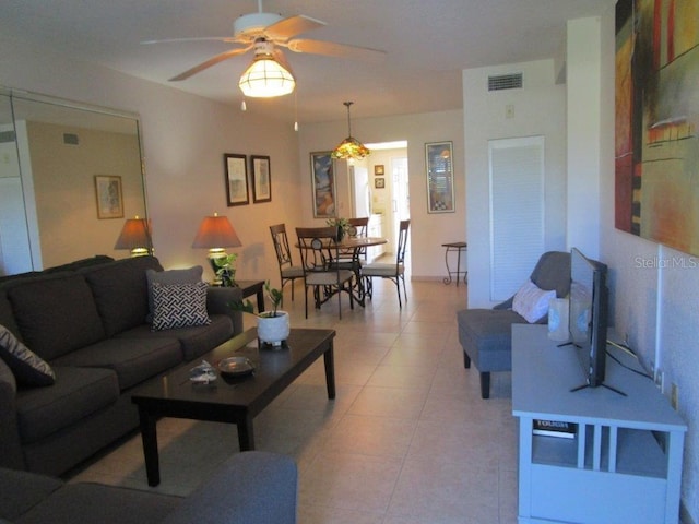 6000 20th St N Unit 114, Saint Petersburg, FL 33714 - living area featuring ceiling fan and light tile patterned flooring
