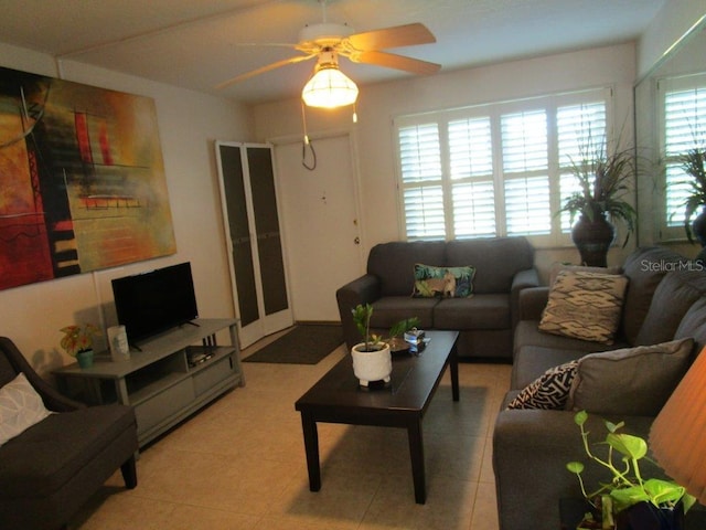 6000 20th St N Unit 114, Saint Petersburg, FL 33714 - living room with a ceiling fan and light tile patterned floors