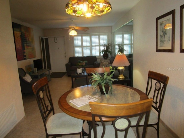 6000 20th St N Unit 114, Saint Petersburg, FL 33714 - dining space featuring a ceiling fan