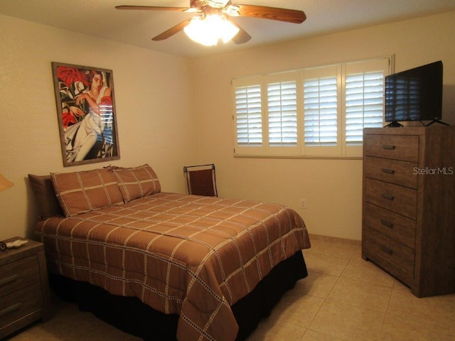 6000 20th St N Unit 114, Saint Petersburg, FL 33714 - bedroom with light tile patterned floors and a ceiling fan