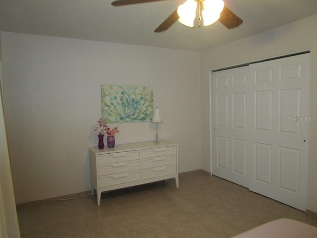 6000 20th St N Unit 114, Saint Petersburg, FL 33714 - unfurnished bedroom with a ceiling fan, light tile patterned flooring, and a closet