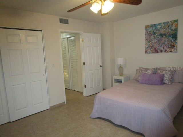 6000 20th St N Unit 114, Saint Petersburg, FL 33714 - bedroom featuring light tile patterned flooring and a ceiling fan