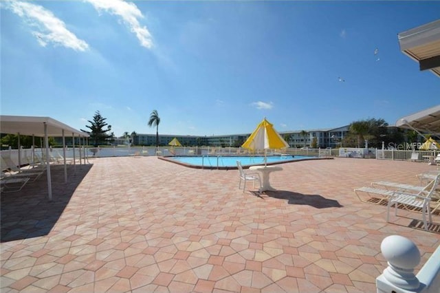 6000 20th St N Unit 114, Saint Petersburg, FL 33714 - community pool featuring a patio
