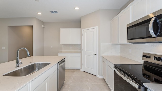 kitchen featuring white cabinetry, stainless steel appliances, and sink