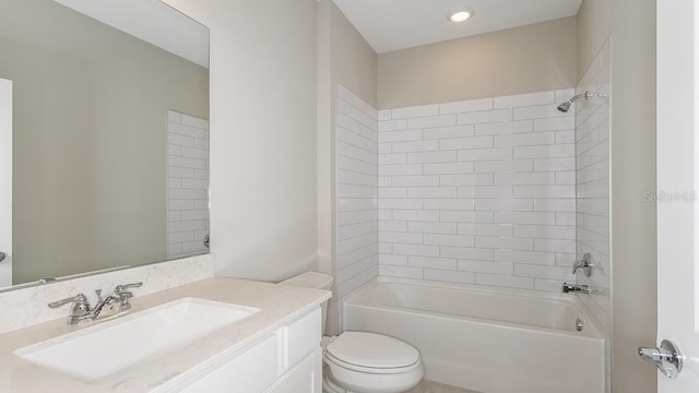 full bathroom with tiled shower / bath combo, vanity, and toilet