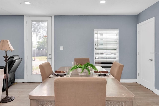 dining area with light hardwood / wood-style floors