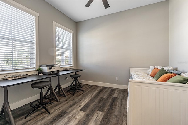 office area with ceiling fan, dark wood-type flooring, and a wealth of natural light