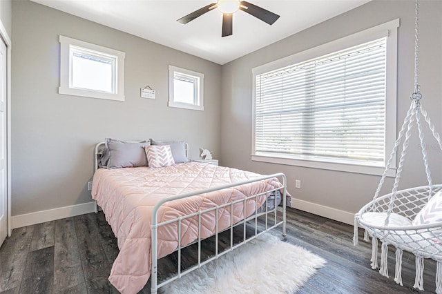 bedroom featuring ceiling fan and dark wood-type flooring