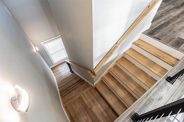 stairs featuring wood-type flooring