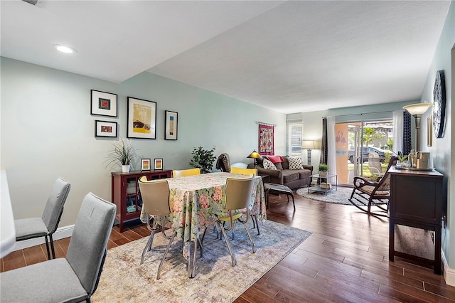 dining room with dark hardwood / wood-style flooring