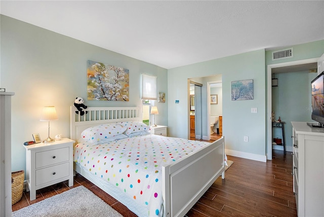 bedroom with dark wood-type flooring