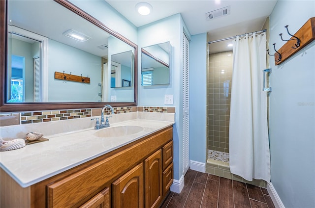 bathroom featuring hardwood / wood-style floors, vanity, and a shower with curtain