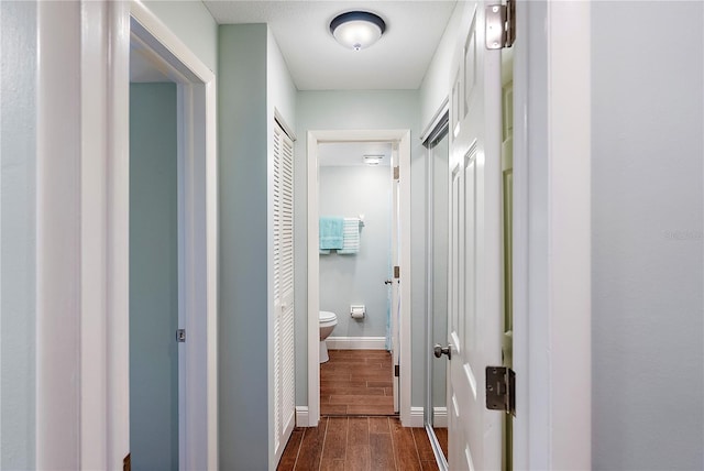 corridor featuring dark hardwood / wood-style floors