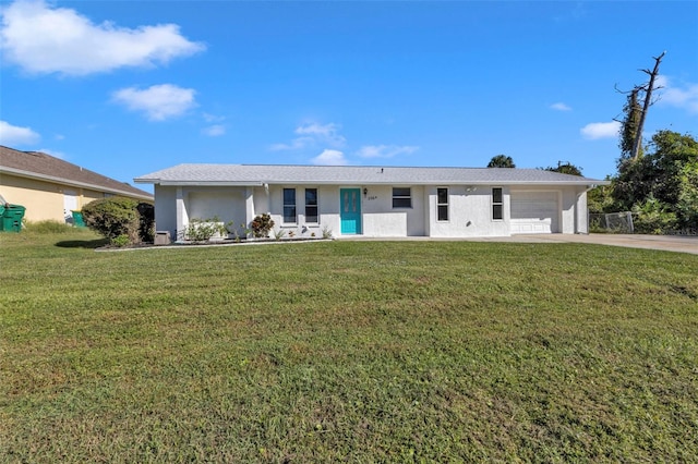 ranch-style home with a front yard and a garage