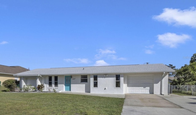 ranch-style house with a front yard and a garage