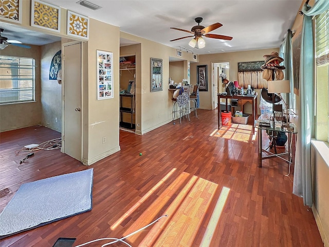 interior space with hardwood / wood-style flooring, ceiling fan, and plenty of natural light