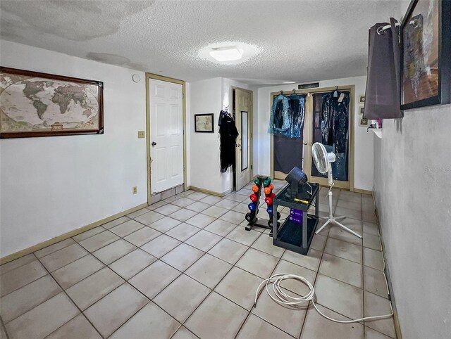 interior space featuring a textured ceiling