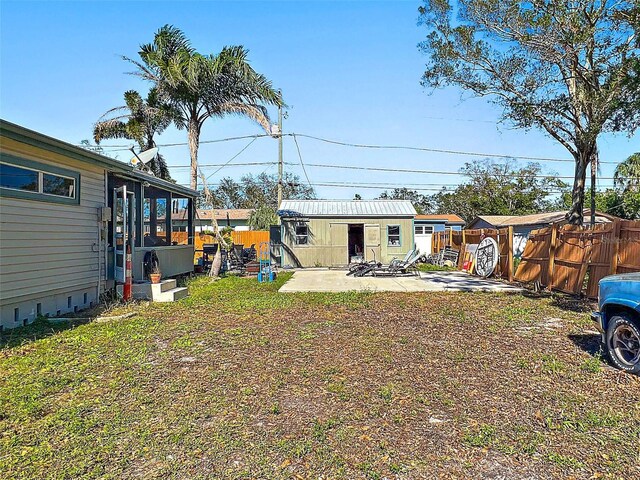 view of yard with a patio area and an outdoor structure