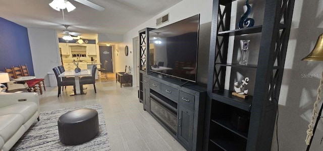 living room featuring ceiling fan