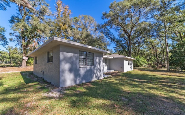 view of home's exterior featuring a yard