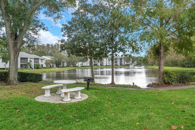 view of yard featuring a water view and a residential view