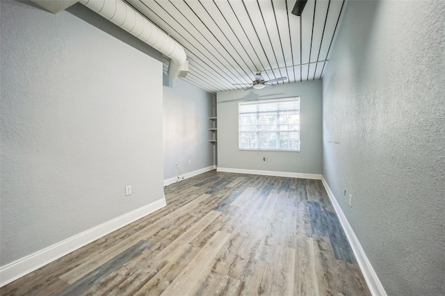 unfurnished room featuring hardwood / wood-style flooring, ceiling fan, and wooden ceiling