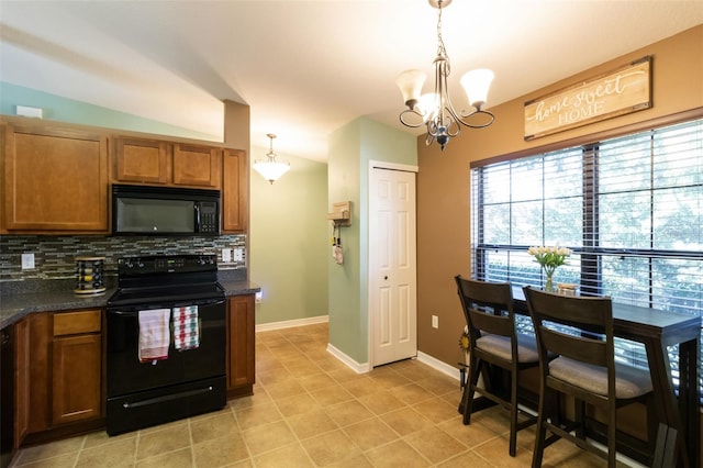 kitchen featuring tasteful backsplash, vaulted ceiling, black appliances, a notable chandelier, and hanging light fixtures