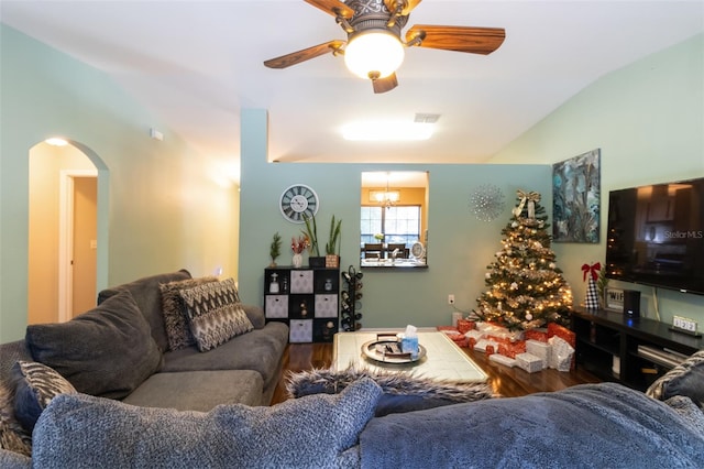 living room featuring ceiling fan, dark wood-type flooring, and lofted ceiling