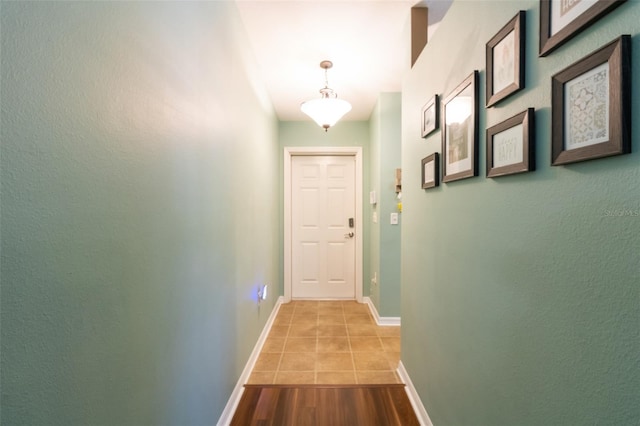 hallway featuring light tile patterned floors