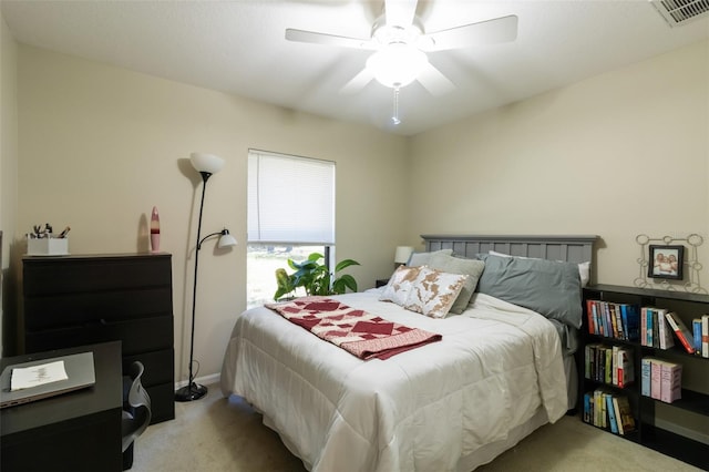 bedroom with ceiling fan and light colored carpet