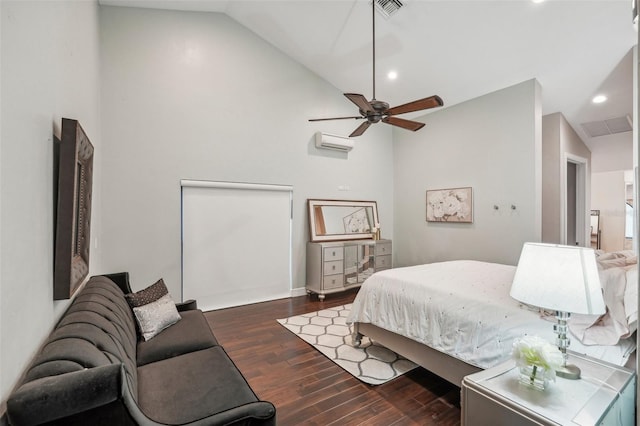 bedroom with visible vents, dark wood-style floors, vaulted ceiling, an AC wall unit, and recessed lighting