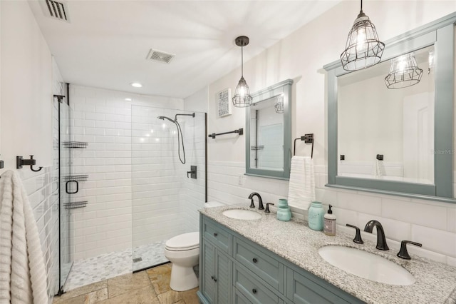 full bath with a stall shower, a sink, and visible vents