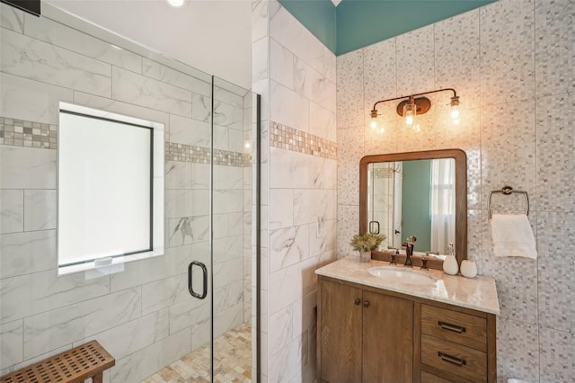 full bathroom featuring a shower stall and vanity