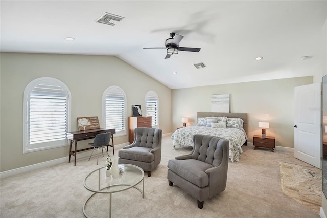 bedroom featuring lofted ceiling, visible vents, and light colored carpet