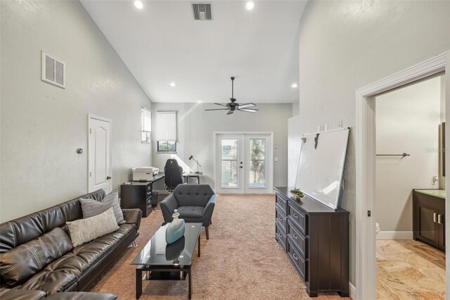 living room featuring recessed lighting, visible vents, light colored carpet, and french doors