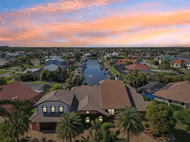 bird's eye view featuring a residential view and a water view