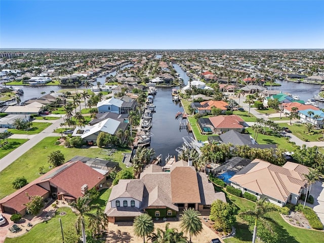 bird's eye view featuring a water view and a residential view