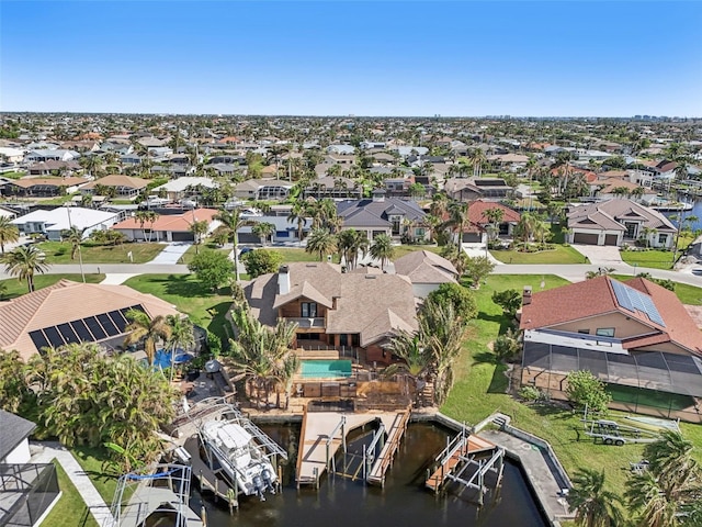 aerial view featuring a water view and a residential view