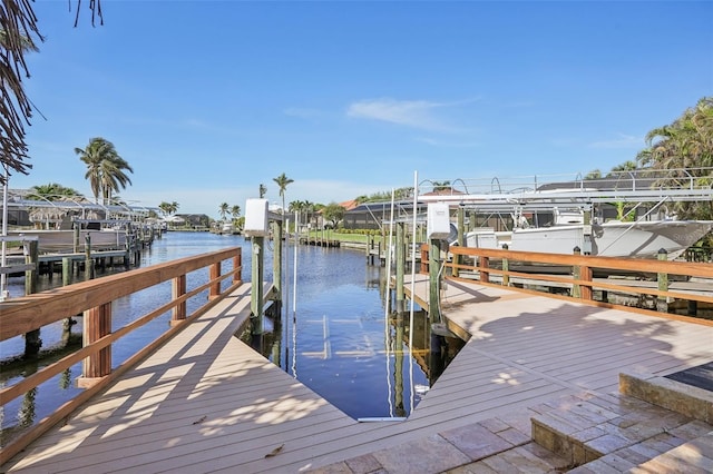 view of dock featuring a water view and boat lift