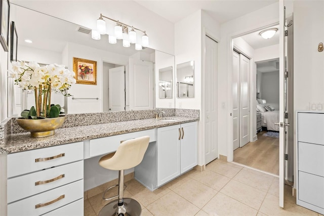 bathroom with vanity and wood-type flooring