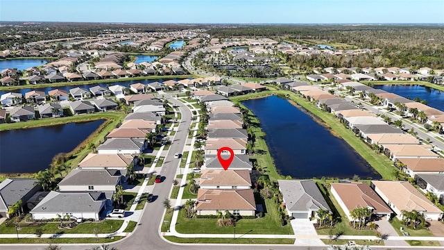 bird's eye view with a water view