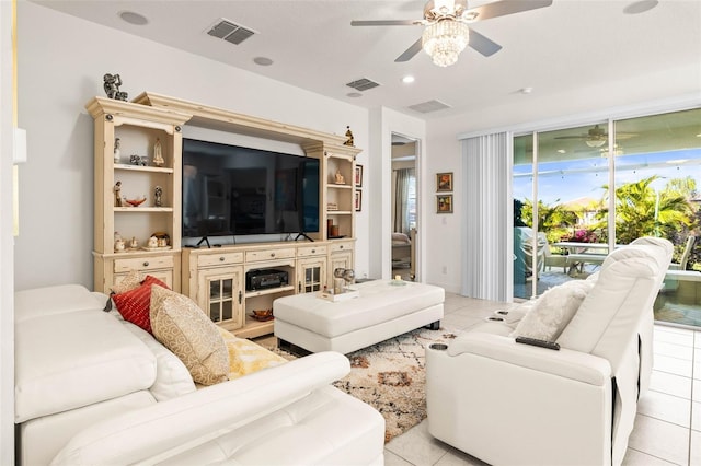 tiled living room featuring ceiling fan