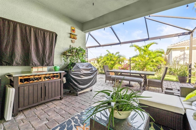 view of patio with area for grilling and an outdoor hangout area