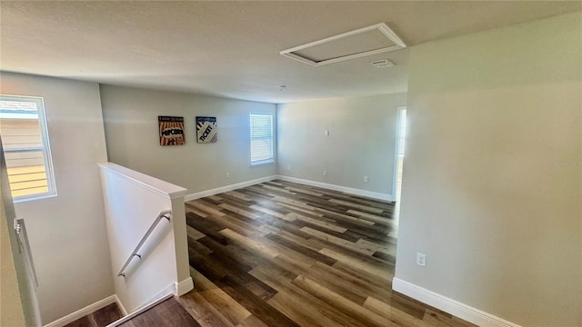 unfurnished room featuring dark hardwood / wood-style floors