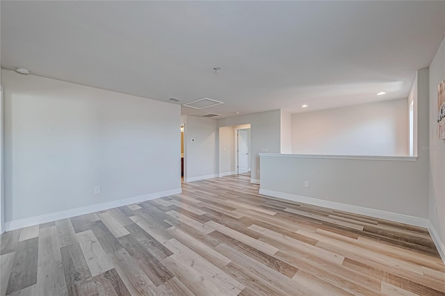 spare room with light hardwood / wood-style flooring