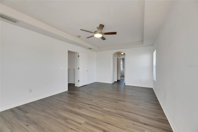 empty room featuring ceiling fan and hardwood / wood-style floors