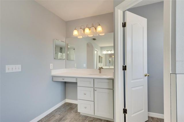 bathroom featuring hardwood / wood-style floors and vanity