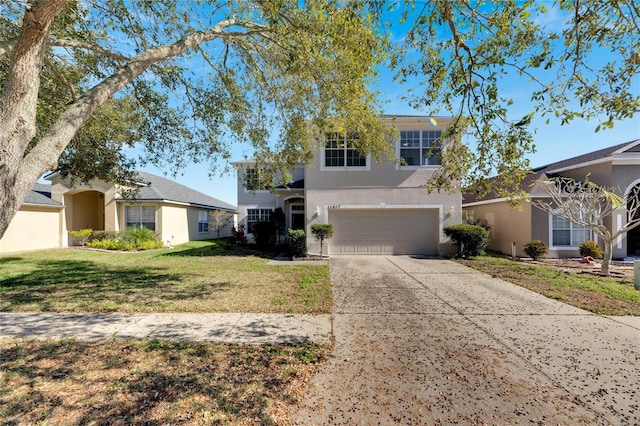 view of front facade with a front yard and a garage