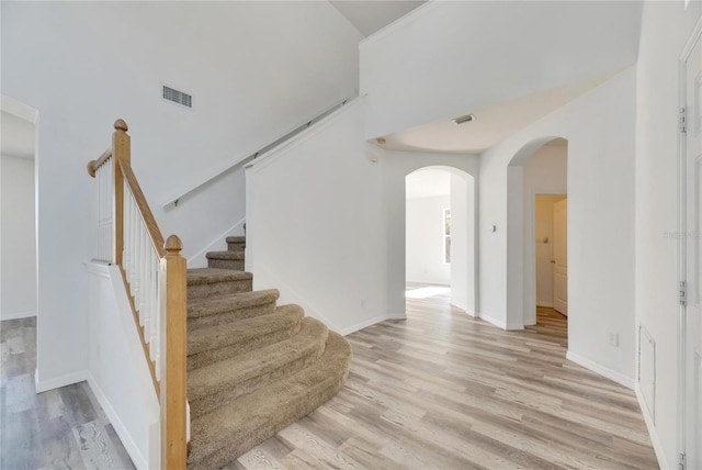 staircase featuring hardwood / wood-style flooring