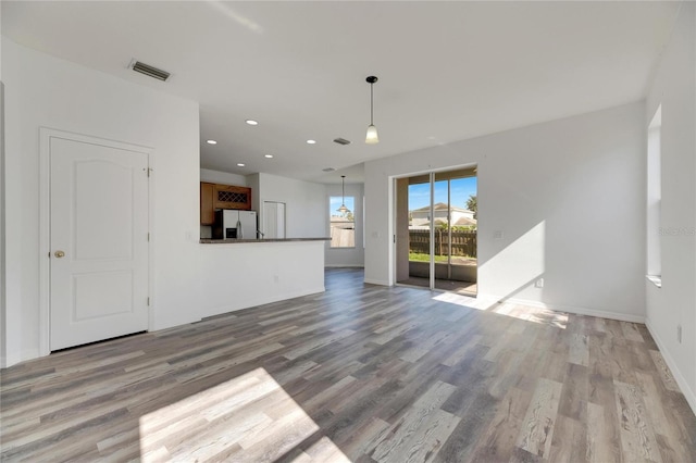 unfurnished living room with light wood-type flooring